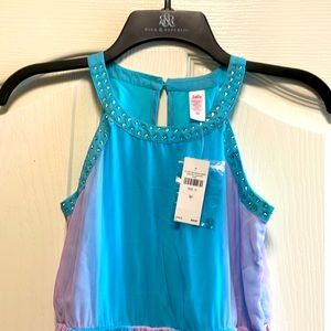 Justice dress new with tags. Brand new never worn size 10 rainbow dress